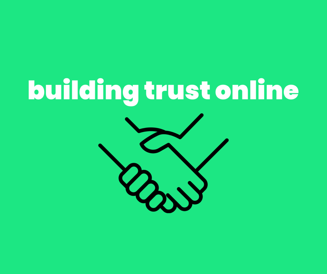 An outlined image of two people shaking hands with the words building trust online.